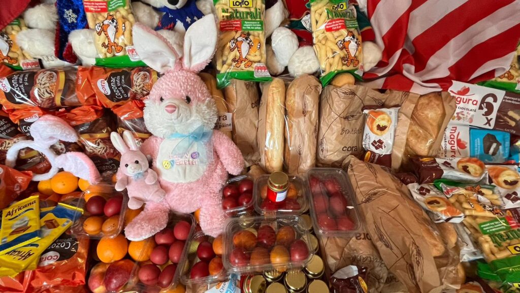 A table filled with lots of food and stuffed animals.